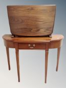 An Ercol elm and beech flap sided coffee table in antique finish, width 69 cm,