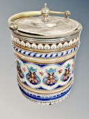 A Victorian ceramic biscuit barrel with plated lid