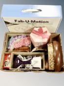 A box of wooden fruit bowls, linen pieces, vintage travel iron, garment steamer,