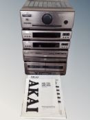 An Akai five piece hifi separate system with instruction books
