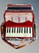A Hohnica piano accordion in case