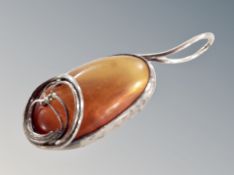 A silver amber pendant