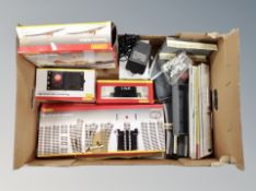 A box of Hornby Station track packs, crossing points, controller,