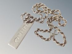 A silver ingot and chain
