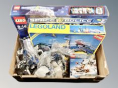 A box of three Lego sets, Space Police 5974, Lego Land Airport 6396,