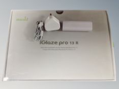 A Moshi i-glaze pro 13 R Macbook case together with an ipod charger