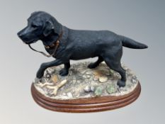 A Border Fine Arts figure of a Labrador BO243B, on wooden plinth, height 17 cm.