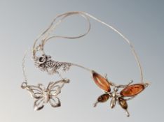 Two silver butterfly pendants and chains