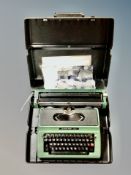 A Silver Reed typewriter in case