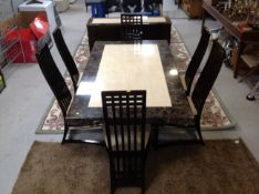 An eight piece laminated marble effect dining room suite comprising of double door sideboard,