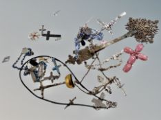 A box of a of number of crosses and crucifixes including an intricate coptic cross and mother of