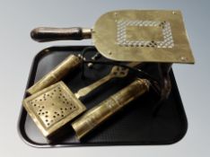 A tray of 19th century brass and cast iron trivet on raised legs,