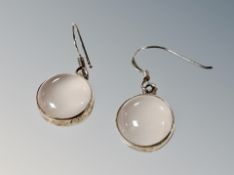 A pair of silver earrings
