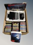 A Sinclair ZX personal computer in original box together with three cases of Commodore 64 games