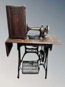 A vintage Jones treadle sewing machine in table