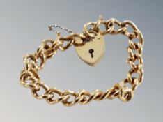A gold plated bracelet with rolled gold padlock