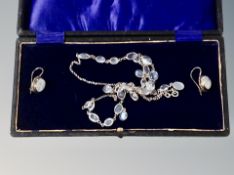 A silver moonstone earring and necklace set