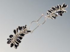 A pair of silver earrings