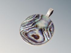 A silver mother of pearl pendant