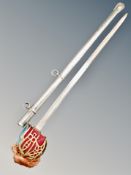 A brass-hilted Scottish sword in scabbard