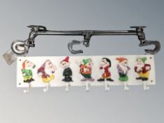 A cast iron seven dwarfs seven-hook wall rack together with an industrial style three-hook wall