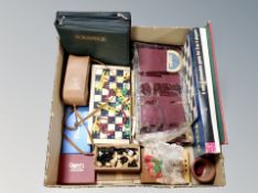 A box of vintage board games, playing cards,