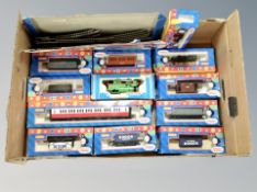 A box of thirteen boxed Hornby Thomas the Tank Engines, coaches, wagons together with a train pack,