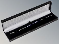A silver and blue sapphire bracelet
