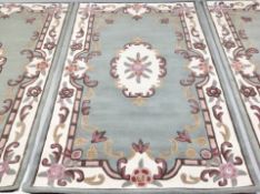 An Indian rug on green ground,