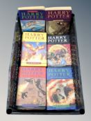 A crate of six Harry Potter paper back and hardback volumes