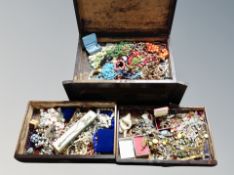 An antique cutlery canteen containing large quantity of costume jewellery