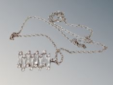 A silver pendant and chain