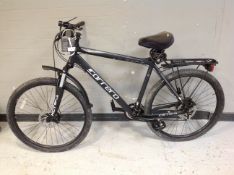 A Carrera Vengeance aluminium front suspension mountain bike with rear pannier