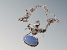 A heavy silver pendant and chain