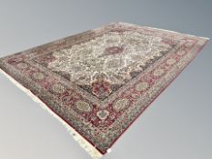 A machine made carpet of Persian Kirman design,