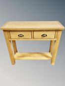 A Oak Furniture Land contemporary oak two drawer side table,