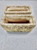 A pair of concrete troughs,