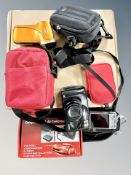 A boxed security camera together with air compressor, digital cameras,