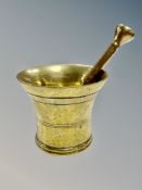 A brass pestle and mortar