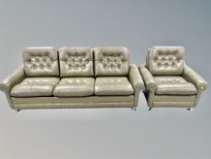 A 1970's buttoned olive leather three seater settee on chrome feet together with matching armchair