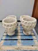 A pair of concrete garden planters,