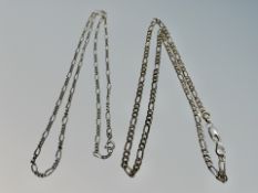 A silver figaro chain together with a further smaller link chain