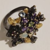 Ethiopian Opal gemstone sterling silver ring with Black Rhodium & Gold plating. 6x4 mm size.