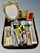 Three brass Art Nouveau style photograph frames, quantity of stainless steel flatware,