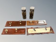 A pair of African carved wooden statues and four gun plinths