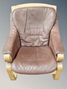 A Scandinavian bentwood armchair in Burgundy leather upholstery