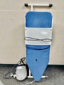A Philips steam iron and ironing board