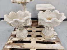 A pair of concrete urns on pedestals height 46 cm