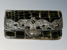 A silver mounted crocodile leather purse