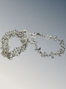 A 925 silver chain mail bracelet together with 925 bracelet with links made of musical notes